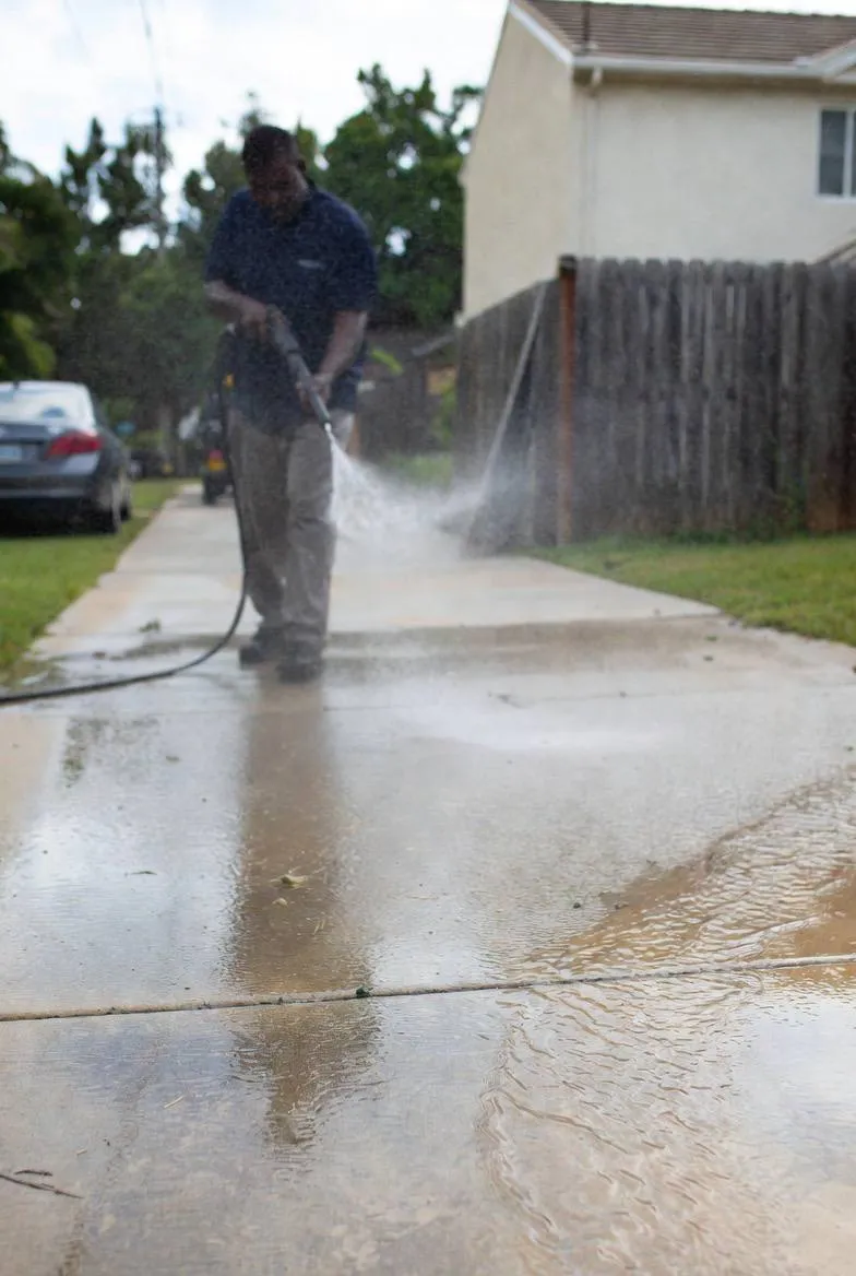 Concrete driveway professionally pressure washed in Rochester NH